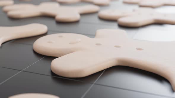 Laid out gingerbread cookies on a pastry rack.