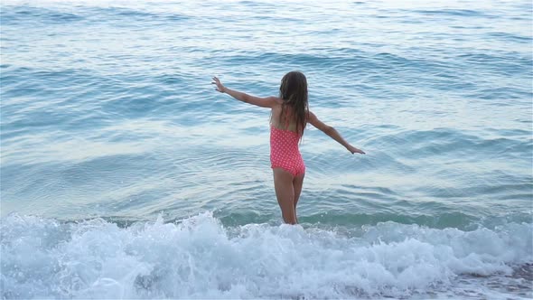 Cute Little Girl at Beach During Summer Vacation