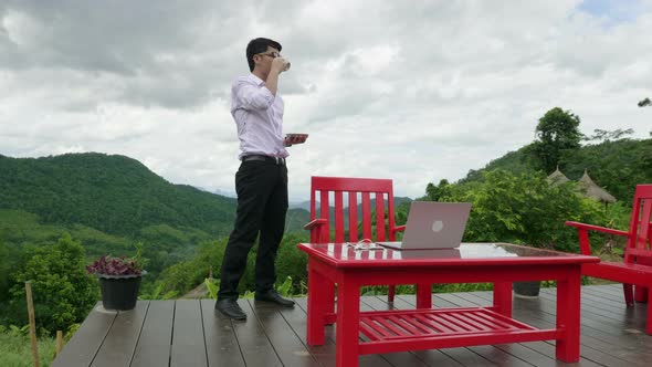 Man Drinking Cafe With Beautiful View