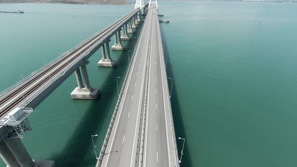 Aerial View of a Bridge Over the Sea with Calm Water