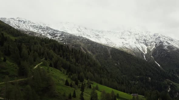Panoramic View of a Picturesque Mountain Valley with a Village in a Lowland