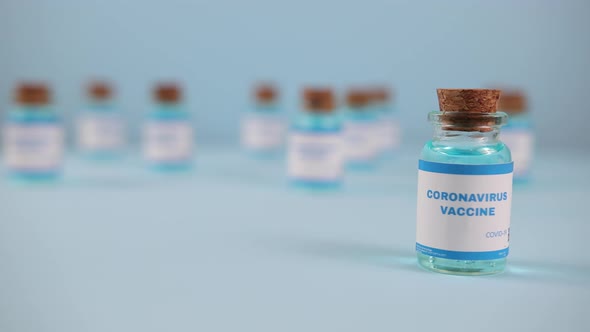 New Vaccine Pfizer Biontech Isolated on Blue Background