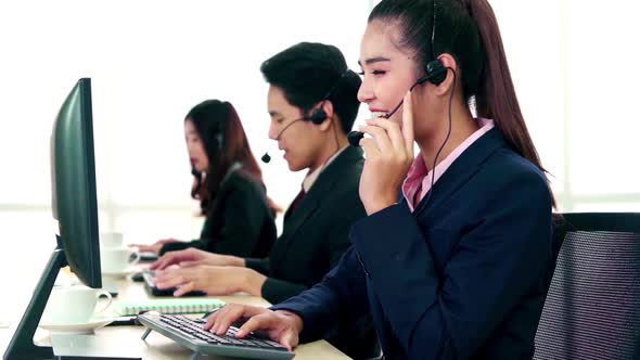 Business People Wearing Headset Working in Office