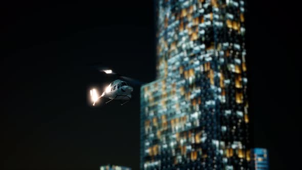Slow Motion Helicopter Near Skyscrapers at Night alt