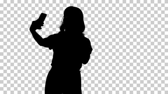 Silhouette Cute girl making selfie walking, Alpha Channel