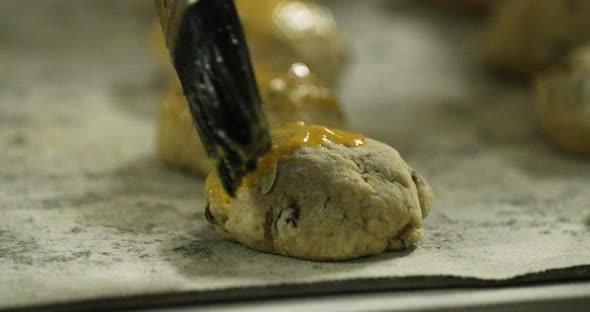 Brushing Cookie Dough With Beaten Egg Before Baking - slow motion