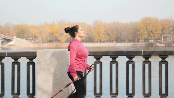 Nordic Walking training in the industrial city along the river and promenade