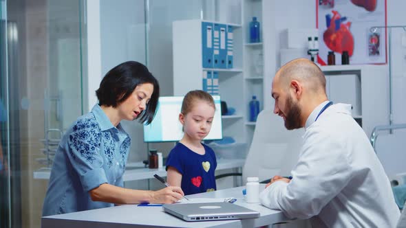 Mother Completing a Medical Questionnaire