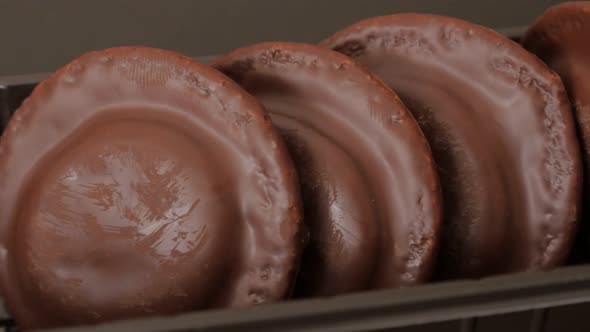 Chocolate glazed orange biscuits in plastic package slow panning 4K 2160p UltraHD footage - Slow pan