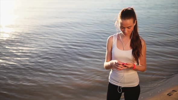 Young Woman Using Smartphone Outside