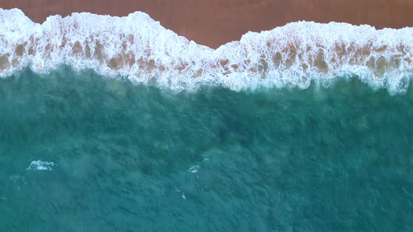 Top View of the sea surface Waves crashing Foaming and Splashing in the Ocean Slow motion