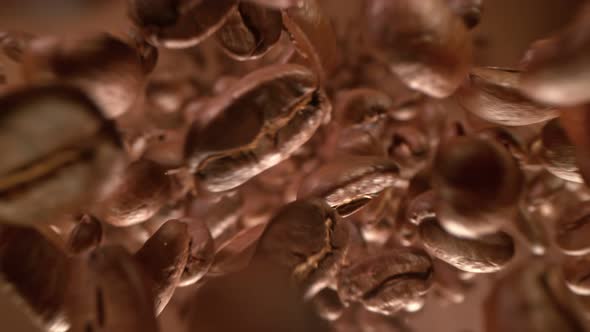 Super Slow Motion Detail Shot of Coffee Beans Flying Towards Camera at 1000Fps