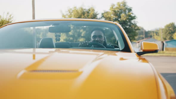 Young Handsome African Businessman in a Car Rental Service