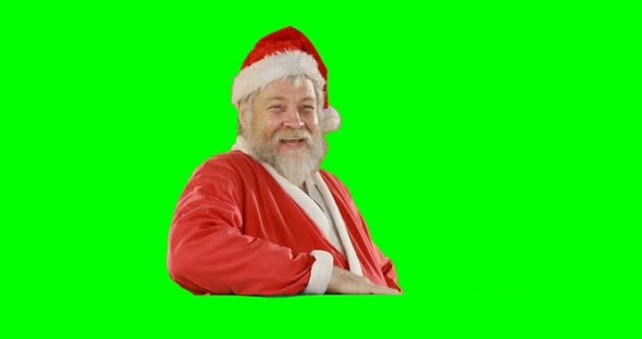 Portrait of happy santa claus waving hand