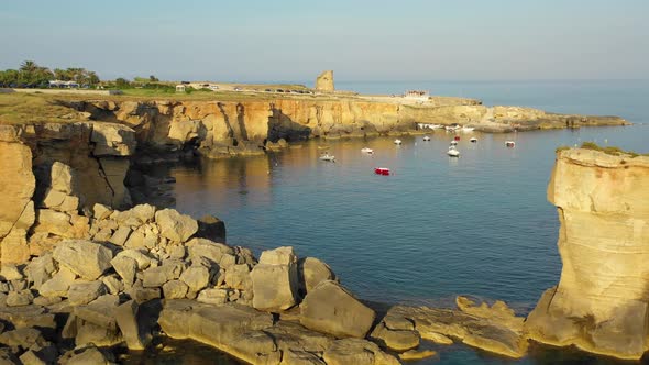 Sea, Cliffs and Boats at Sunset