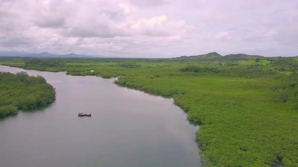 Scenic view on river with small boat in Boca Chica, Panama. Slow motion