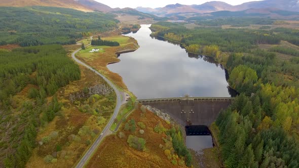 Aerial view of Laggan dam artificial lake and beautiful countryside and wood