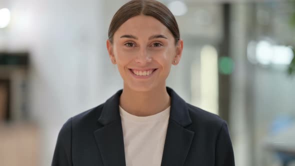 Portrait of Smiling Businesswoman Looking at Camera 