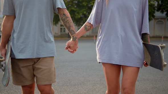 Active Couple Walking Tattoo Hand in Hand