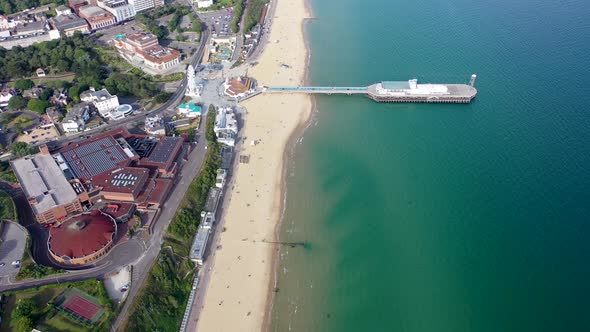 Aerial drone footage of the Bournemouth beach, Observation Wheel and Pier on a beautiful sunny day