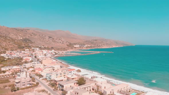 Drone flying over small Greek town.