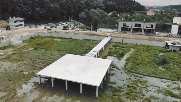 Flight Over the Unfinished Helipad. Helicopter Platform Made of Concrete.