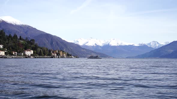 Passenger Ferry Sails Past the Shores of Lake Como