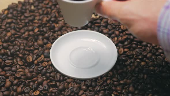 Male Hand Takes a Mug of Coffee