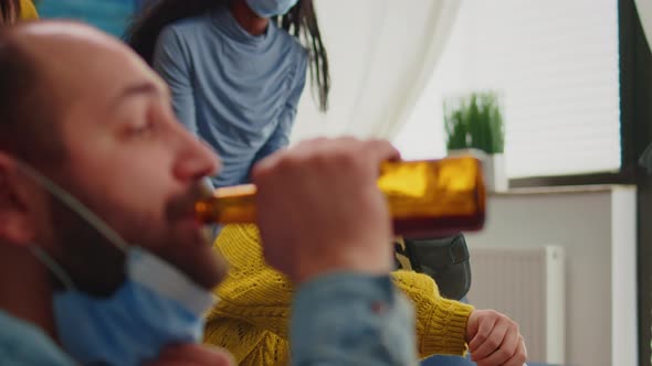 Friends Supporting Woman During Video Game Playing with Vr Goggles