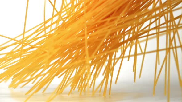 Super Slow Motion Pasta Spaghetti Dry Falls on the Table