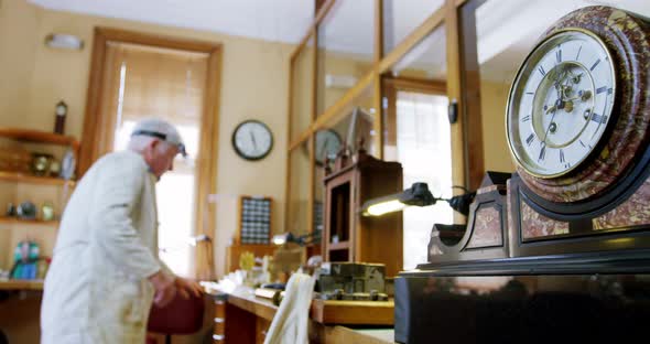 Horologist repairing a watch