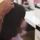Hands of Hairdresser Smooth Hair on Head of Young Girl - VideoHive Item for Sale