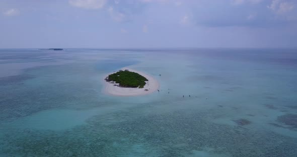 Luxury flying clean view of a sunshine white sandy paradise beach and aqua blue water background in 