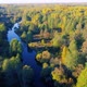 Aerial View of the River Among Forest in the Wild During Fall Season at Sunset - VideoHive Item for Sale