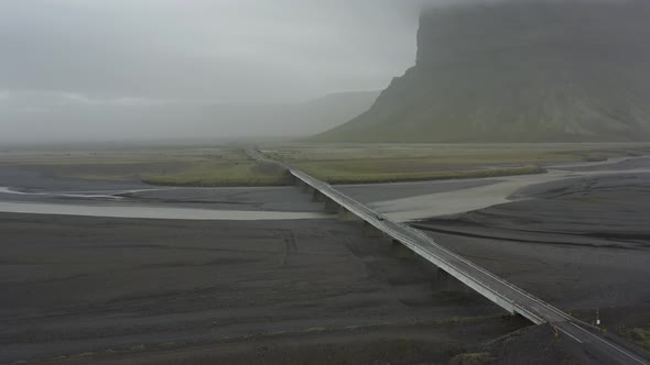 Aerial shot of a one way bridge in Iceland in the ring road on a foggy day.