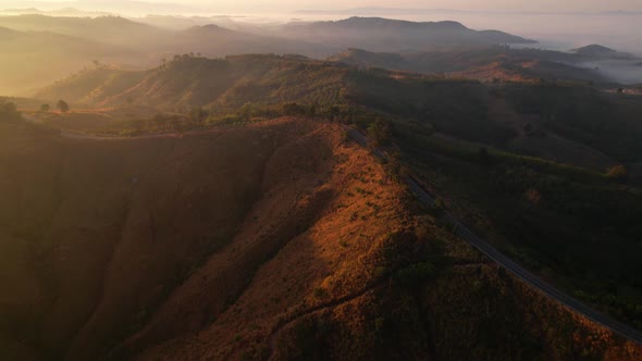 4K High mountain road in fog. Tropical forest with smoke and fog.