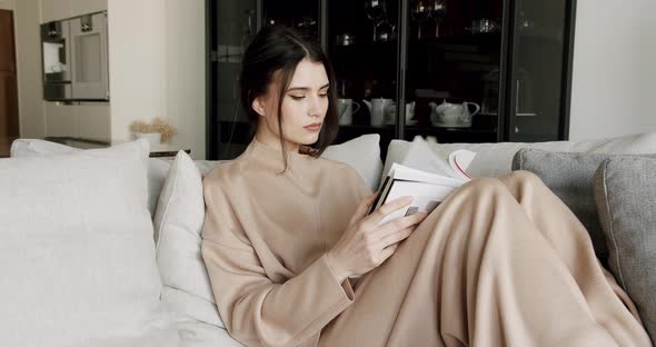 Attractive Lady Enjoying Spending Leisure Time with Read Modern Novel Literature