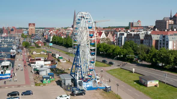 Rising View of Running Ferris Wheel