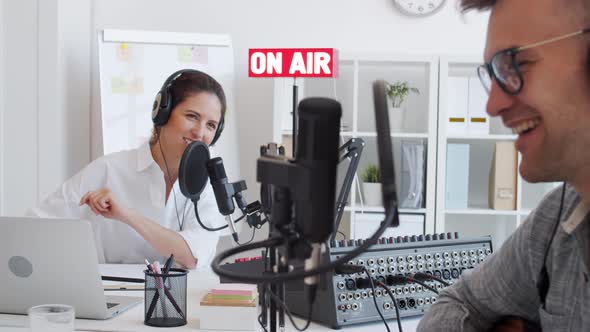 Two Radio Hosts Recording Podcast
