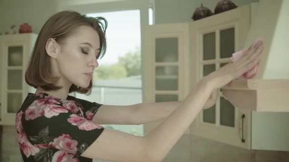 Beautiful Young Brunette Woman In Dress Kitchen At Home