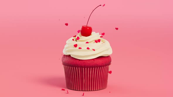 A cupcake with cream and cherry. Valentines' decorating. Heart-shaped sprinkles.