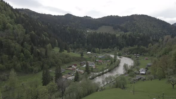 River in the Mountains. Slow Motion. Carpathians. Ukraine. Aerial. Gray, Flat