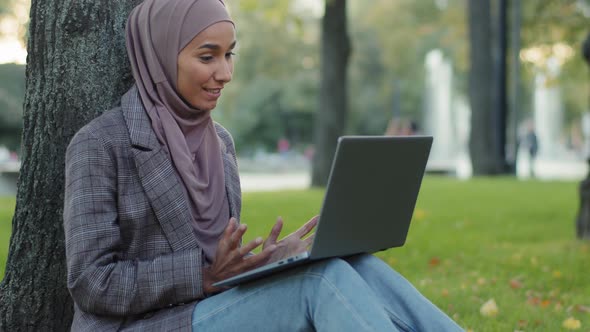 Happy Smiling Friendly Islamic Business Woman Muslim Student Girl Teacher Wearing Hijab Sitting on