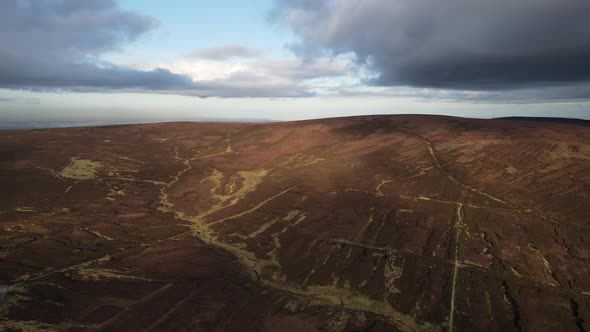 Aerial View Of Turf Hills In The Wicklow Mountains, Ireland On An Overcast Day - drone shot