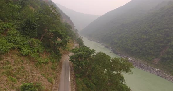 Car is driving on the mountains. Shot on drone