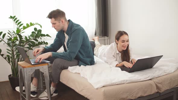 Young Caucasian Business Family Work at Home Even in Quarantine.