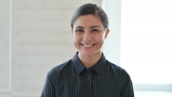 Smiling Young Indian Woman Looking at Camera 