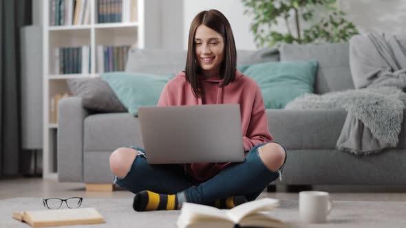 Positive Student Using Laptop for Distance Learning