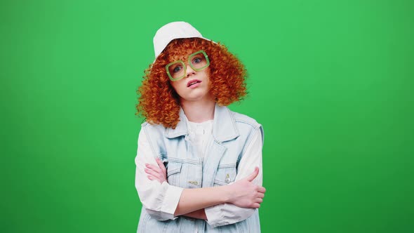 Young Boring Redhead Woman Rejecting Bad Idea Rolling Up Eyes and Covering Face with Panama Hat