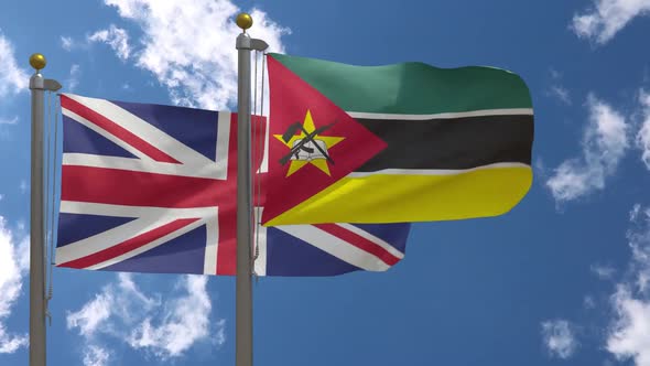 United Kingdom Flag Vs Mozambique Flag On Flagpole